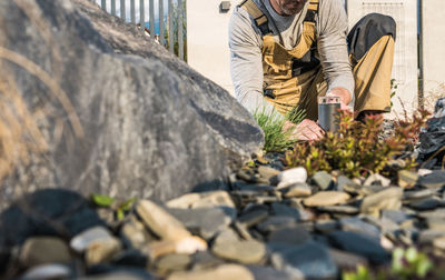 Man working in garden on sunny day