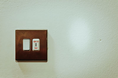 Close-up of mailbox on wall