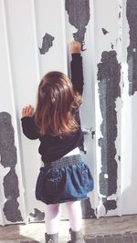 Rear view of girl at home
