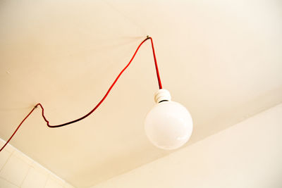 High angle view of electric lamp against wall at home