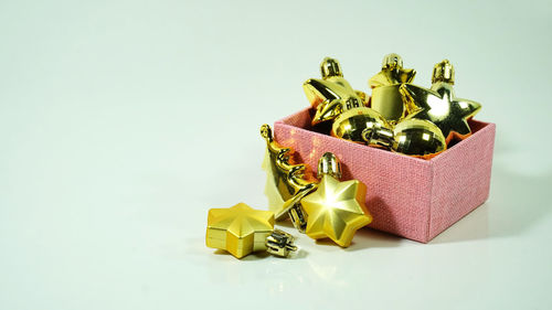 Close-up of christmas decorations over white background