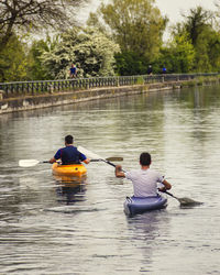 Man kayaking in lake