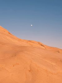 Scenic view of desert against clear sky