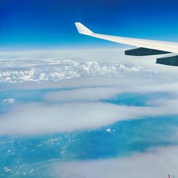 Aerial view of aircraft wing over sea