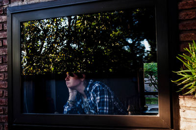 Man sitting in window