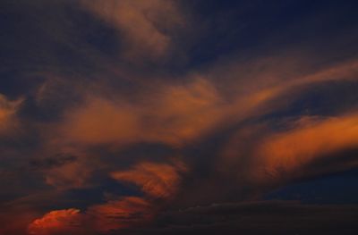 Low angle view of dramatic sky during sunset