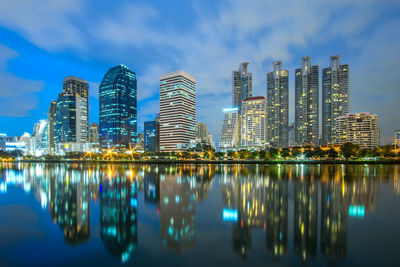 Reflection of illuminated buildings in city