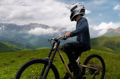 Man riding bicycle on mountain