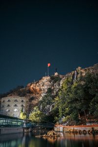 Scenic view of lake against sky at night