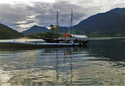 Scenic view of calm lake against mountain range