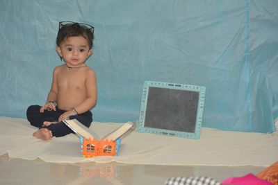 High angle view of cute boy at toy at home