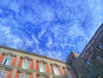 Low angle view of building against cloudy sky