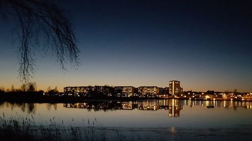 Reflection of city in water at night