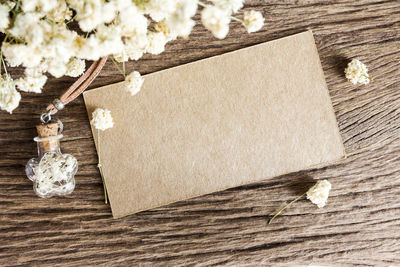 Close-up of white flower on wooden table
