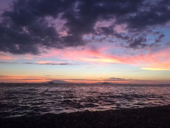 Scenic view of sea against romantic sky