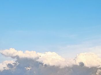 Low angle view of clouds against blue sky