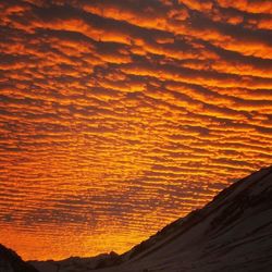 Scenic view of dramatic sky during sunset