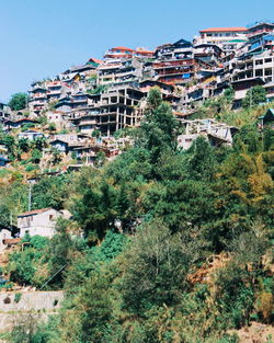 High angle view of trees and houses against sky