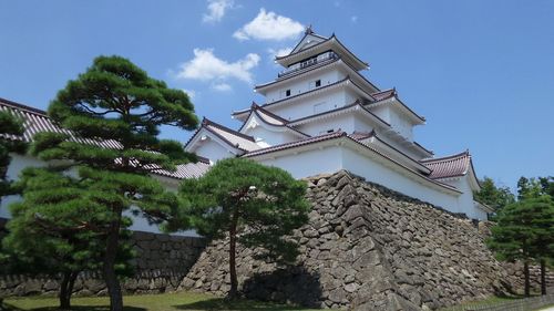 Low angle view of built structure against blue sky