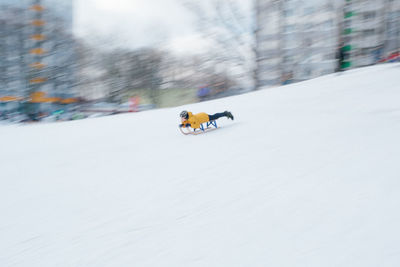 People riding motorcycle on snow