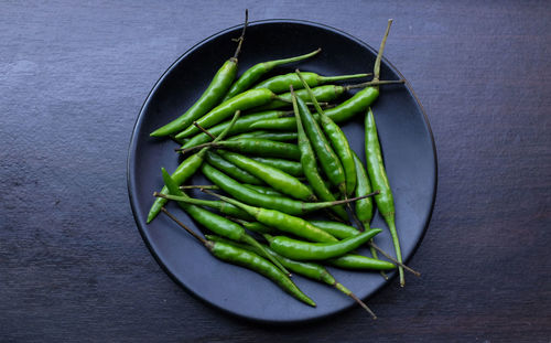 High angle view of red chili peppers on table