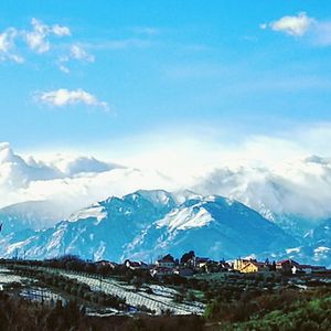 Scenic view of mountains against blue sky