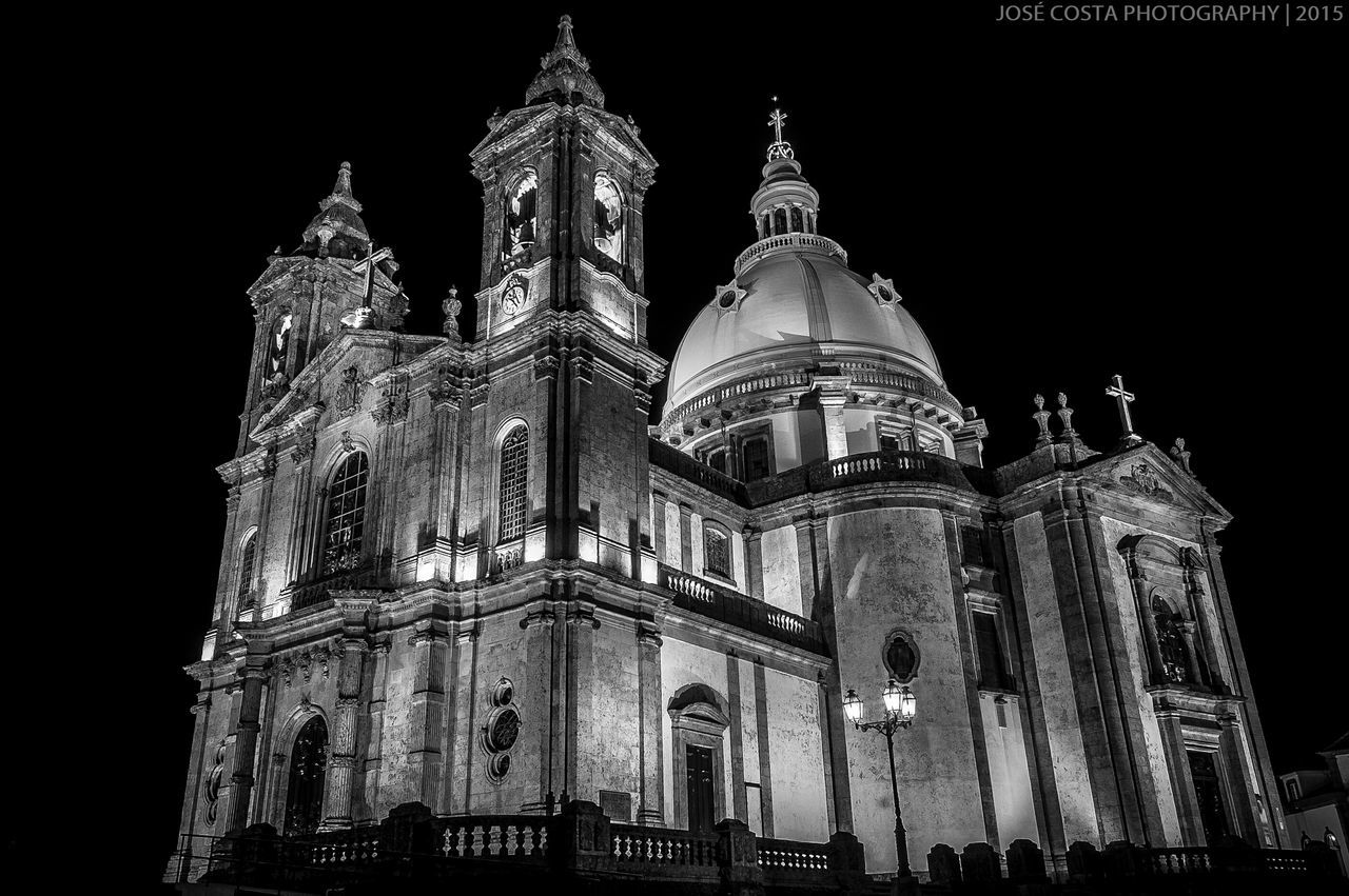 architecture, night, built structure, building exterior, illuminated, low angle view, famous place, travel destinations, religion, place of worship, history, tourism, spirituality, international landmark, travel, cathedral, facade, sky, capital cities