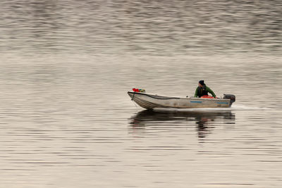 High angle view of man on boat in lake