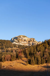 Scenic view of mountains against clear blue sky