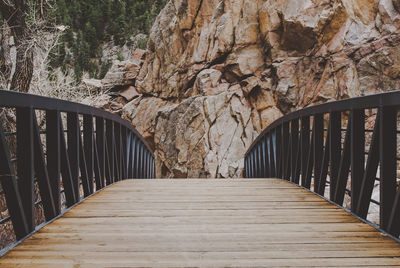 Boardwalk amidst railing