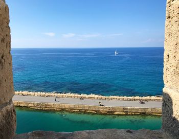 Scenic view of sea against blue sky