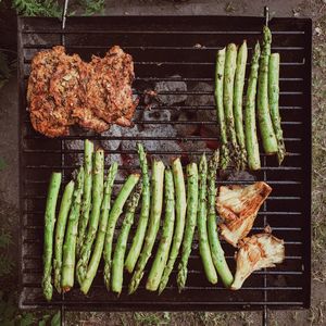 High angle view of meat on barbecue grill