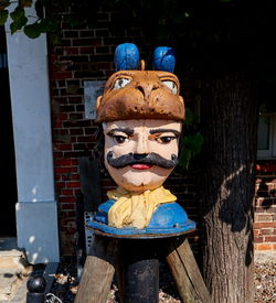 Close-up of statue against wall