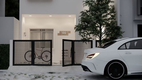 Bicycle against white building