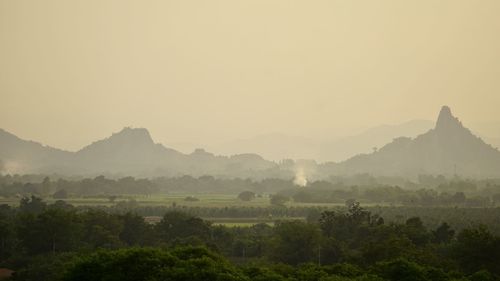 Scenic view of landscape and mountains against sky