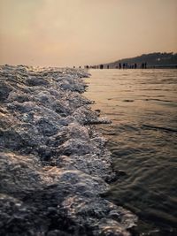 Scenic view of sea against clear sky during sunset