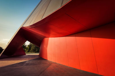 Red umbrella against sky