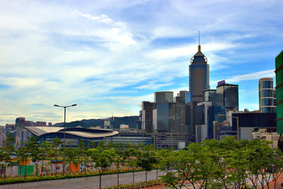 Buildings against cloudy sky