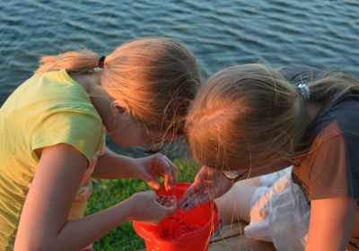 Sisters playing at lakeshore