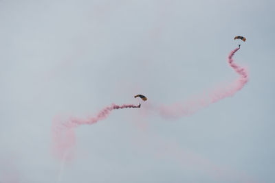 Low angle view of airshow in sky