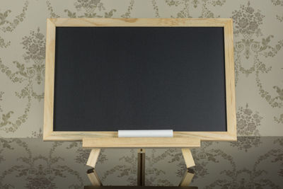 Close-up of blackboard on table