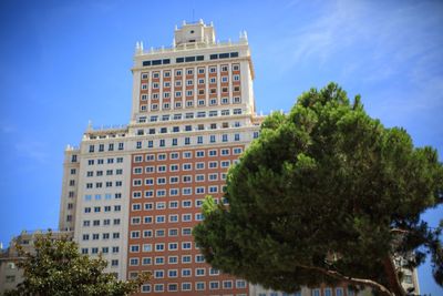 Low angle view of building against blue sky