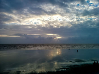 Scenic view of sea against sky at sunset