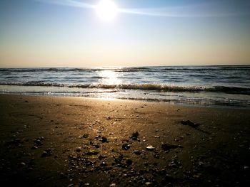 Scenic view of sea against sky on sunny day