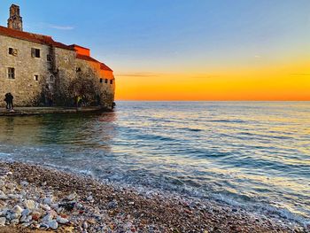 Scenic view of sea against sky during sunset