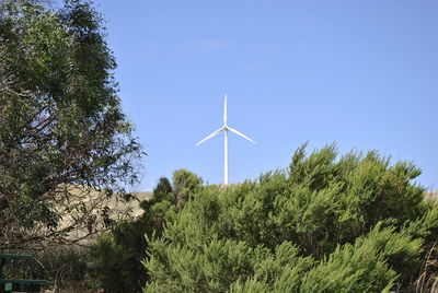 Low angle view of windmill against clear sky