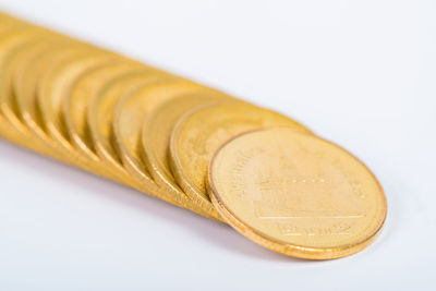 Close-up of coins on white background