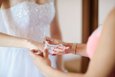 Close-up of couple holding hands