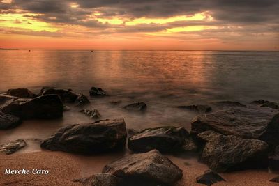 Scenic view of sea at sunset