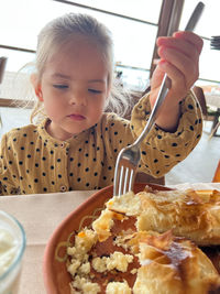 Portrait of cute boy eating food